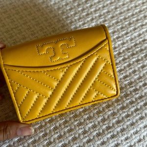 Tory Burch mini wallet in daisy yellow